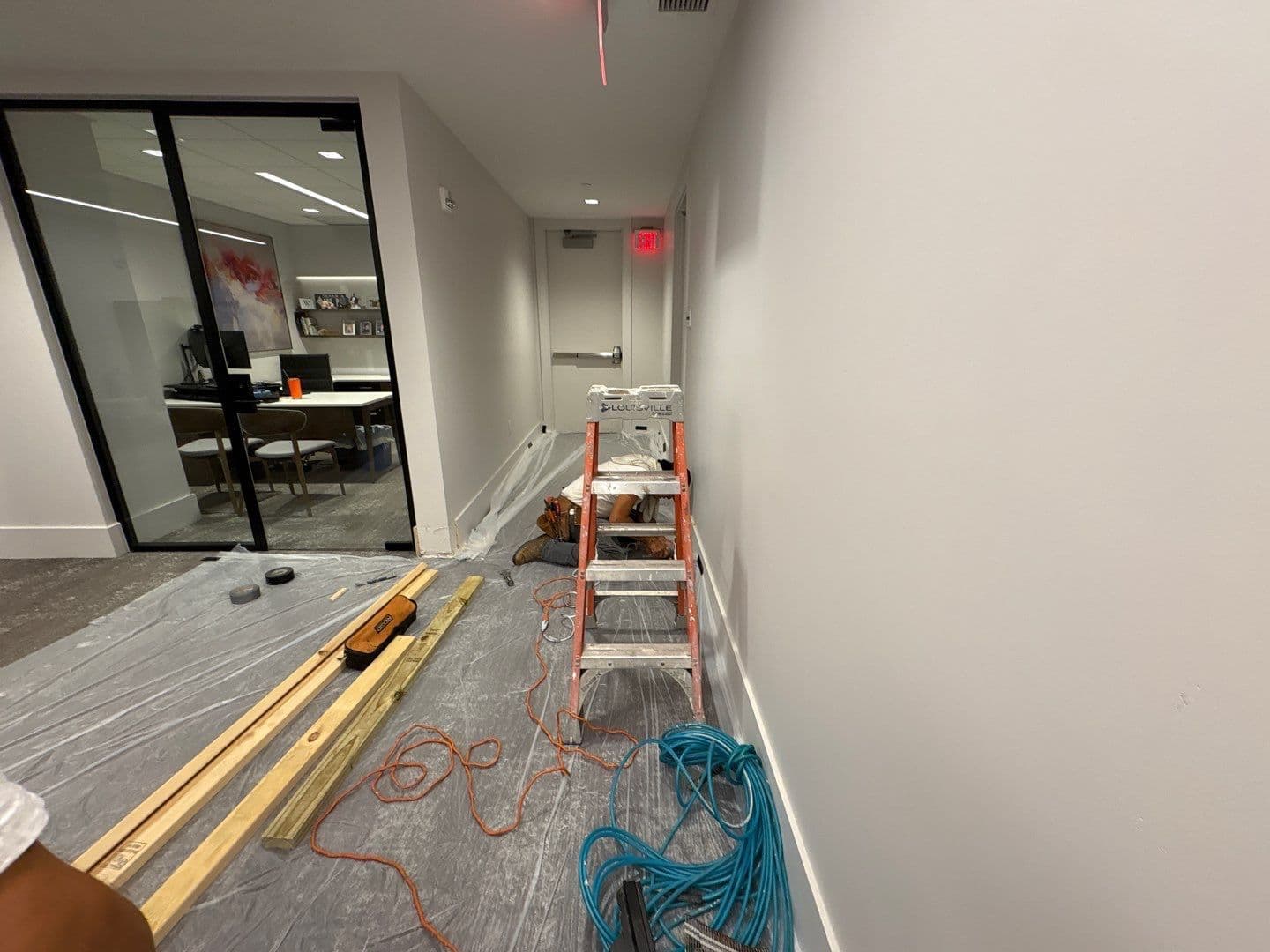 Wall and door add on in a commercial building. - Image 2