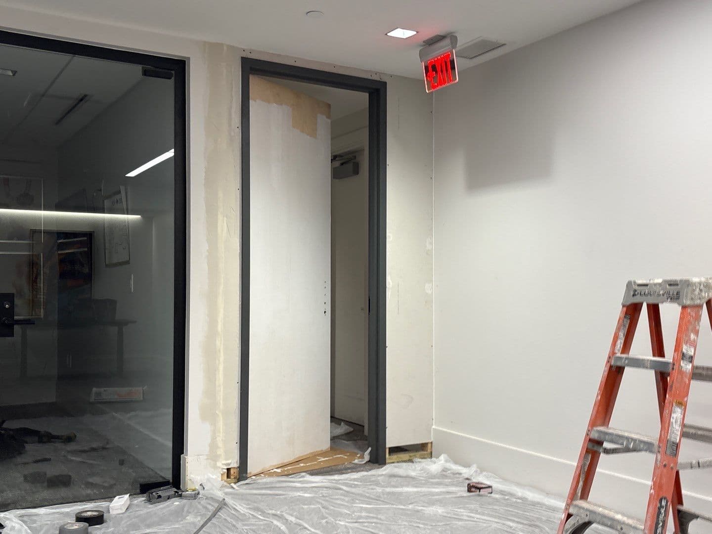 Wall and door add on in a commercial building. - Image 3